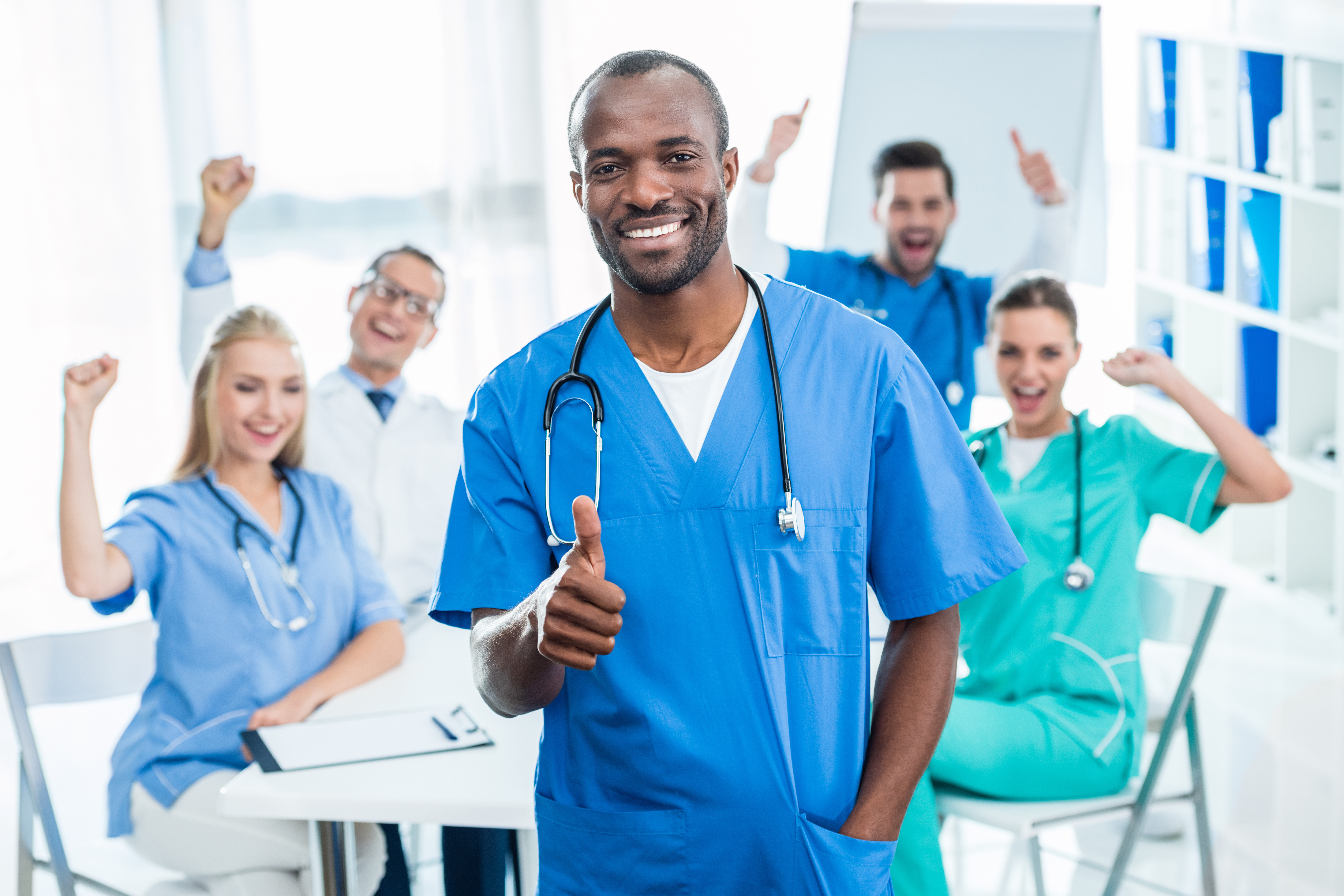 Medical providers dancing and happy